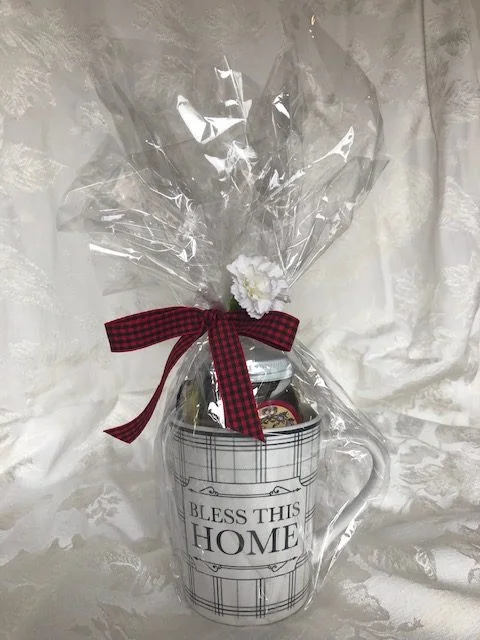 A gift-wrapped mug and honey set