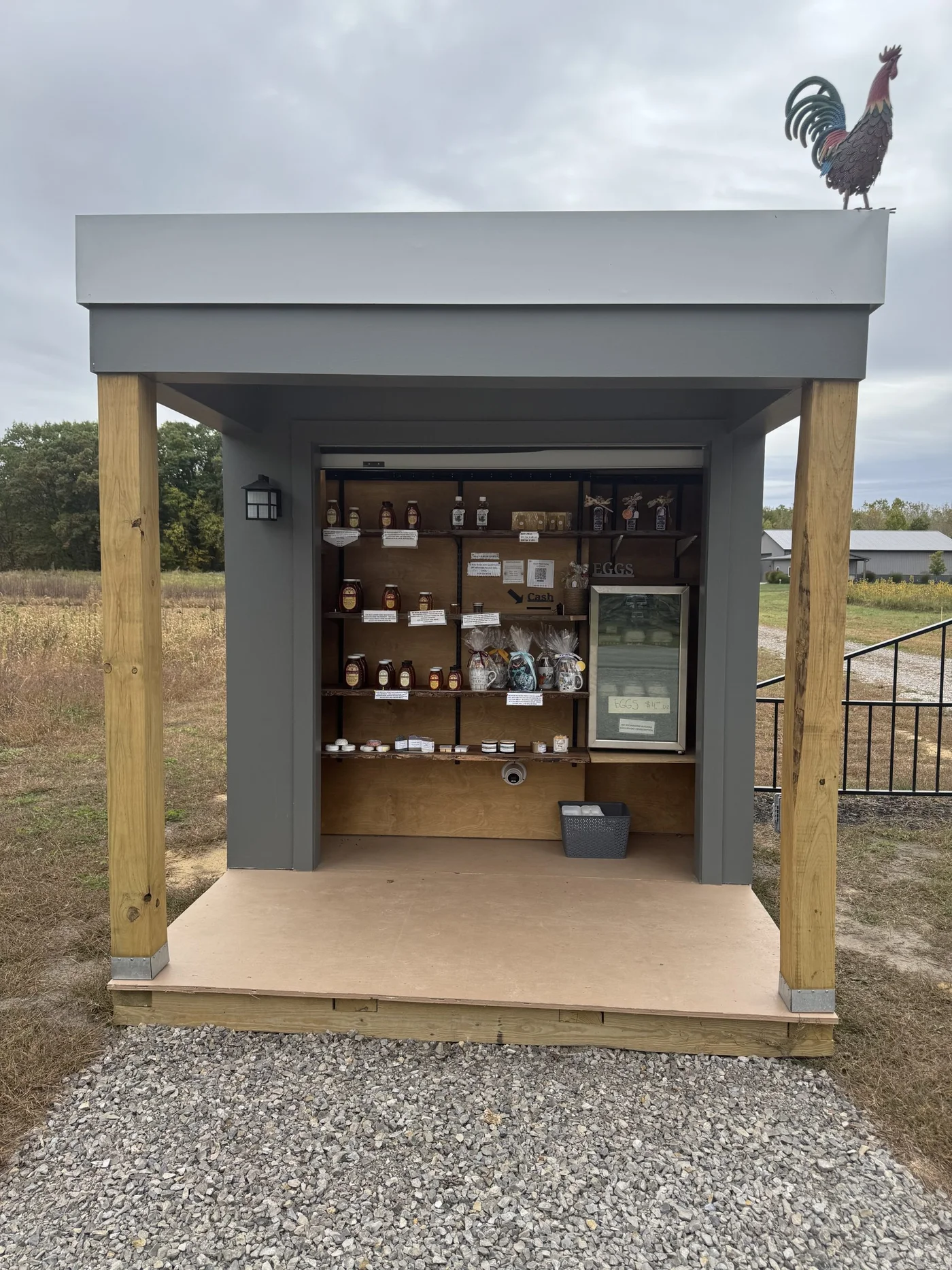 The front of the Local Honey Hive stand and its shelves of honey